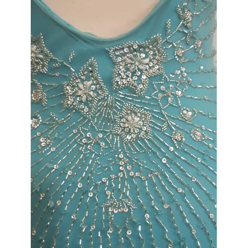 62 - Evening dress by Sagaie in  turquoise silk with beading to front and back and with stretch quality f... 