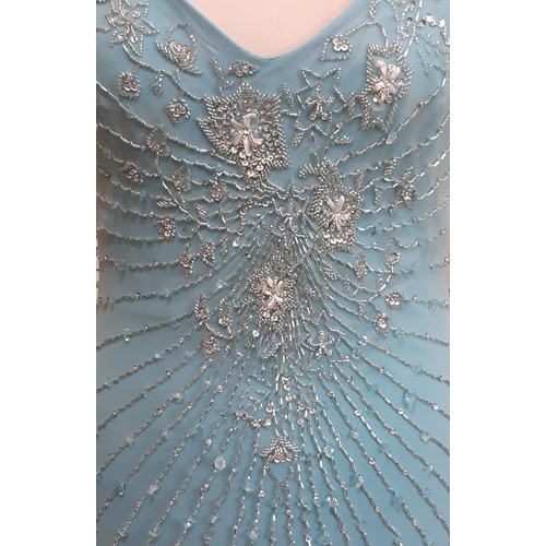 62 - Evening dress by Sagaie in  turquoise silk with beading to front and back and with stretch quality f... 