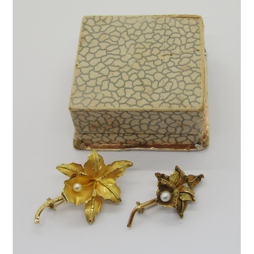 406 - Two vintage Venezuelan orchid brooches, each stamped '18k', 9.4g total, with a Venezuelan box