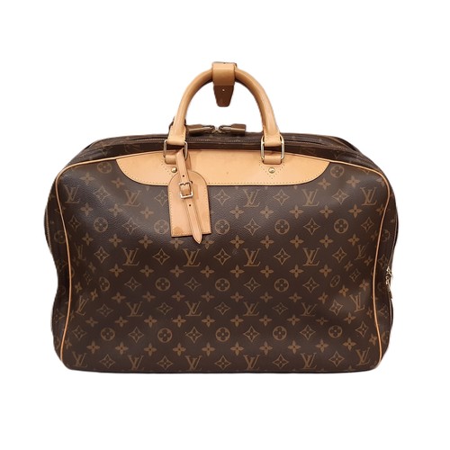 100 - Louis Vuitton Alize 45 travel bag in Monogram Canvas with Vachetta leather trim. The bag has detacha... 