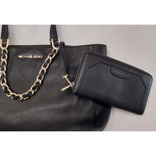 918 - A mixed lot of ladies accessories including Michael Kors handbag in black leather with Coccinelle pu... 