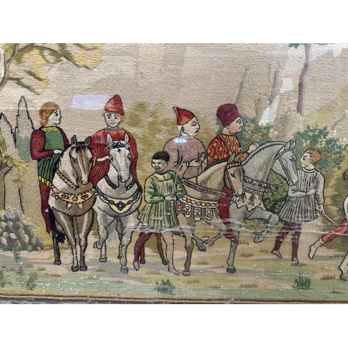 1897 - A large medieval style 20th century wool work, depicting a hunting scene with a floral border, frame... 