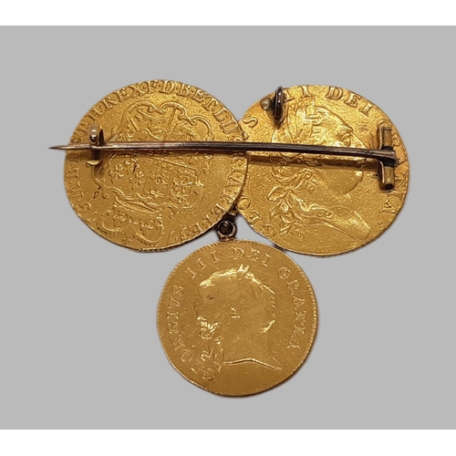 201A - George III 1760-1820, Three gold coins mounted as a pendant brooch, comprising 1775 Guinea, 1787 Gui... 