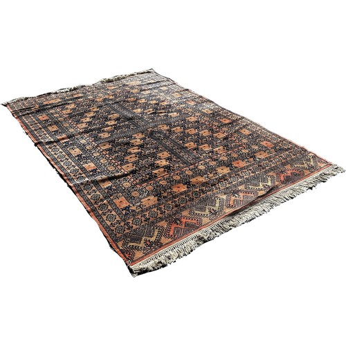 1655 - A Turkey carpet with an all over geometric pattern on an orange ground 240cm x 170cm approximately