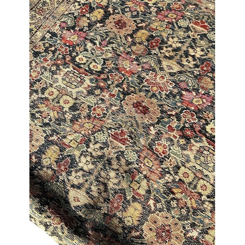 1659 - An old Persian rug with an all over floral pattern 200cm x 120 approximately.