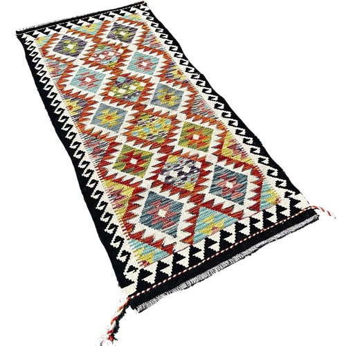 1663 - A Chobi Kilim runner with alternating row of stepped diamonds, 158cm x 72cm approximately