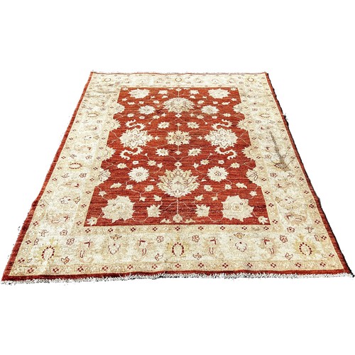 1666 - A Ziegler design carpet with an all over floral pattern with a central red panel, 210cm 150cm approx... 