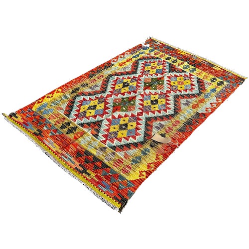 1667 - A Chobi kilim with an all over multicoloured diamond pattern, 159cm x 101cm approximately