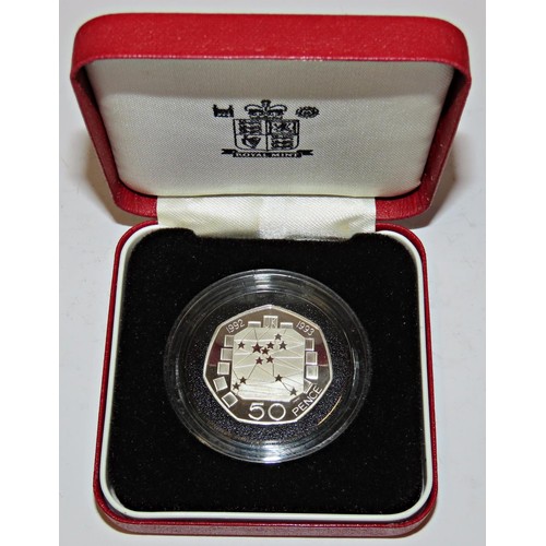 404 - Elizabeth II, Royal Mint cased commemorative silver coins to include 1983 Silver Proof £1 Coin, 1989... 