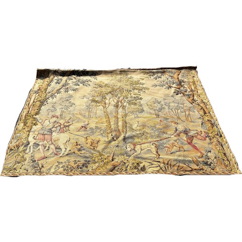 1669 - A large Belgian style tapestry wall hanging, huntsmen and their dogs with a stag amongst woodland, w... 