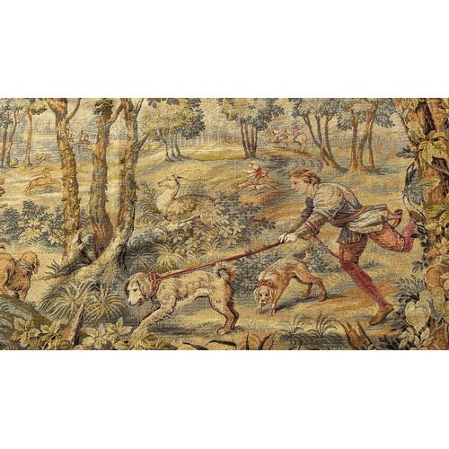 1669 - A large Belgian style tapestry wall hanging, huntsmen and their dogs with a stag amongst woodland, w... 