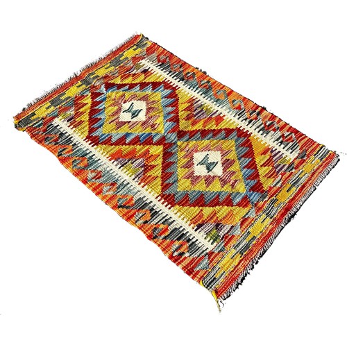 1675 - A Chobi kilim mat with a double diamond panel, 86cm x 57cm