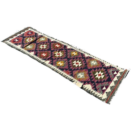 1684 - A Maimana kilim runner with alternating stepped diamonds on a purple ground, 200cm x 58cm approximat... 