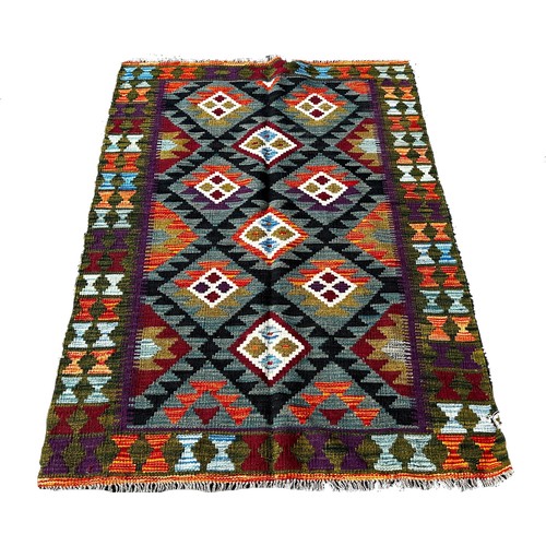 1687 - A Maimana kilim with alternating diamond medallions on a dark field, 148cm x 100cm approximately