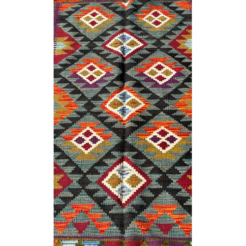 1687 - A Maimana kilim with alternating diamond medallions on a dark field, 148cm x 100cm approximately