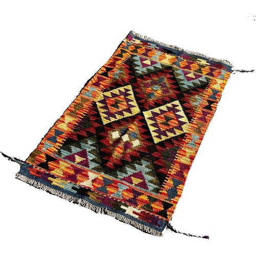 1688 - A Maimana kilim with a central panel of four diamonds on a dark ground, 96cm x 60 cm approximately