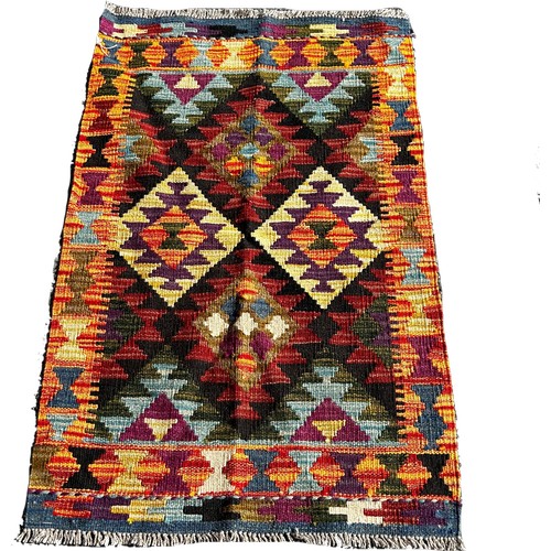 1688 - A Maimana kilim with a central panel of four diamonds on a dark ground, 96cm x 60 cm approximately