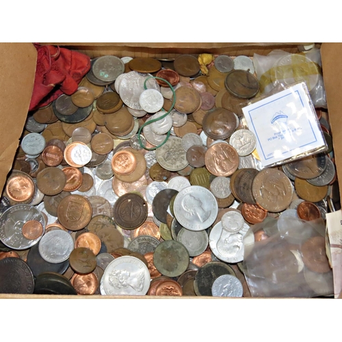 452 - A varied collection, British and world coinage to include commemorative Crowns, a board of Nepalese ... 