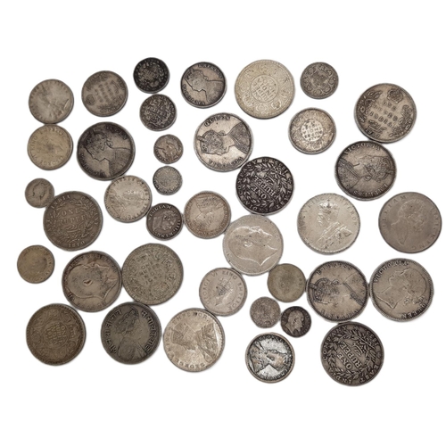 473 - India: A group of British issued William IV, Victoria and later One Rupee, Half Rupee and other coin... 