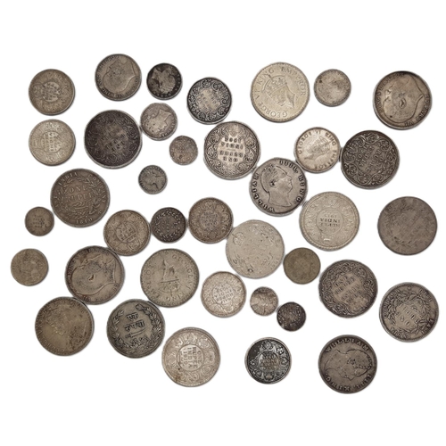 473 - India: A group of British issued William IV, Victoria and later One Rupee, Half Rupee and other coin... 