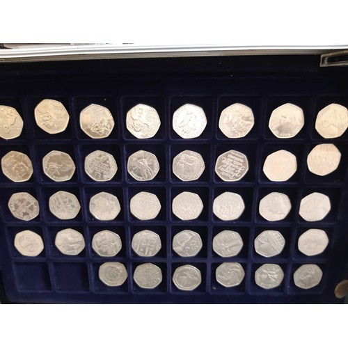 460 - Three modern coin collecting cases containing mixed British and world coins to include commemorative... 