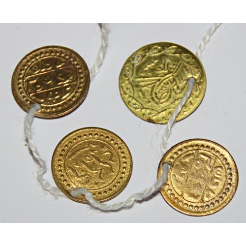 482 - Four small Ottoman pierced gilt coins.