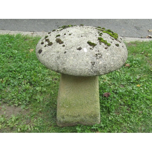 1036 - A small weathered cast composition stone staddle stone and cap, 50cm high.