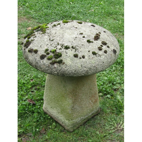 1036 - A small weathered cast composition stone staddle stone and cap, 50cm high.