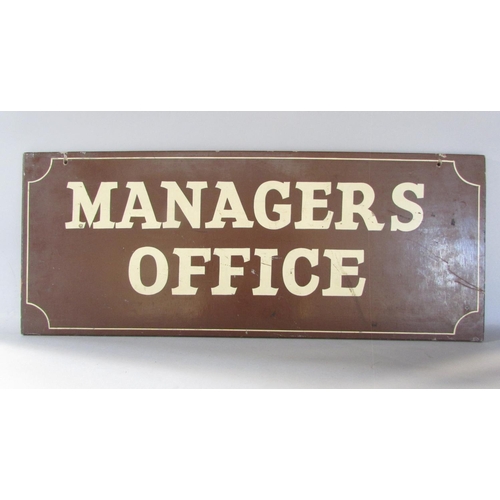 571 - A brown painted wooden sign, possibly railway related, “Managers Office” 77cm x 30cm.