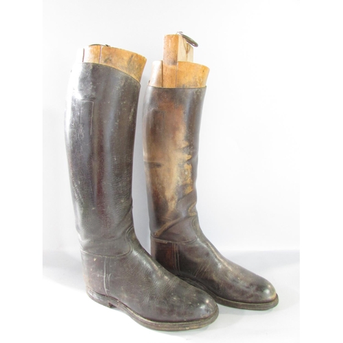 573 - A vintage pair of Gentleman’s brown leather riding boots, size 9 or 10 with wooden trees, together w... 