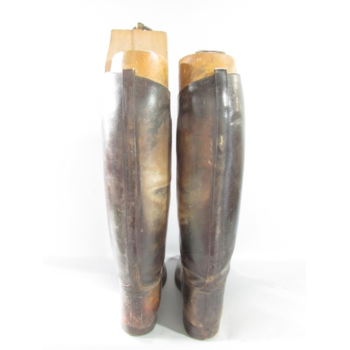 573 - A vintage pair of Gentleman’s brown leather riding boots, size 9 or 10 with wooden trees, together w... 