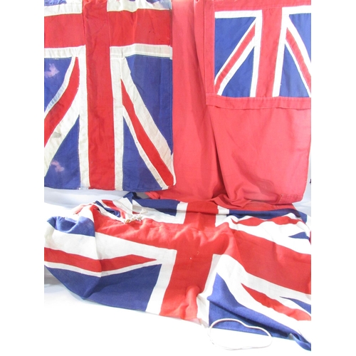 574 - Two vintage linen Union Jacks both 132cm x 67cm (one a bit tatty) and a vintage linen Red Ensign 147... 