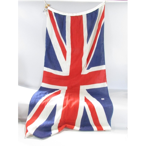 574 - Two vintage linen Union Jacks both 132cm x 67cm (one a bit tatty) and a vintage linen Red Ensign 147... 