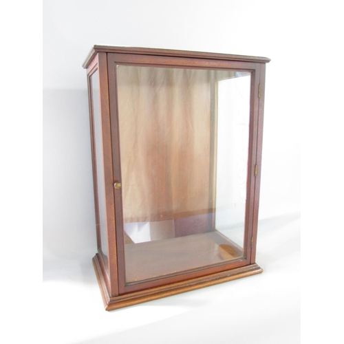 578 - A small floor standing mahogany display cabinet 48cm high x 35.5cm wide.