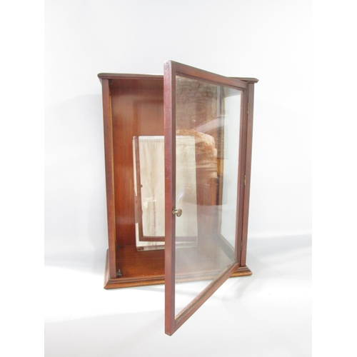 578 - A small floor standing mahogany display cabinet 48cm high x 35.5cm wide.