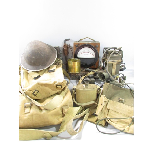 580 - A collection of WWII Equipment, including a ruck sack, webbing, helmet, water bottles, a field radio... 