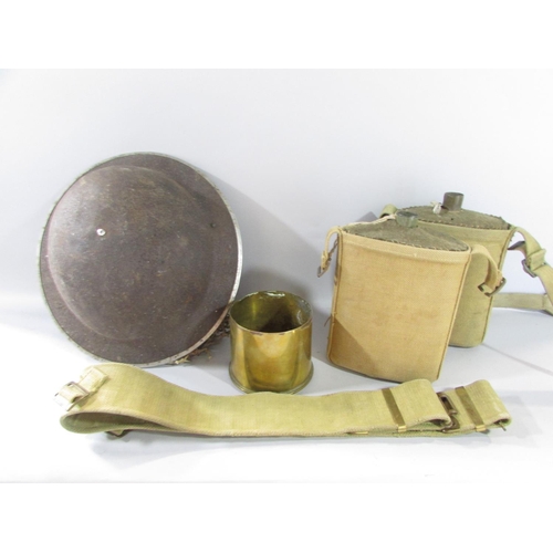 580 - A collection of WWII Equipment, including a ruck sack, webbing, helmet, water bottles, a field radio... 