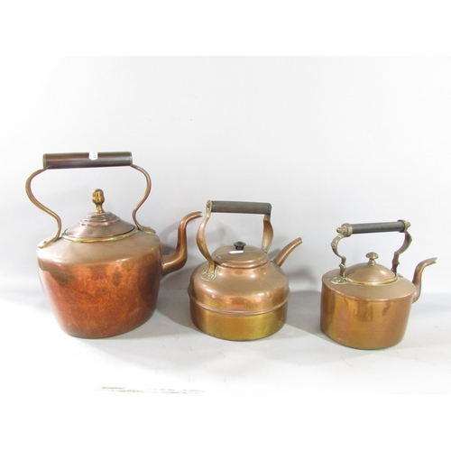 581 - A quantity of old copper and brass items, including a cauldron, weighing scale, kettles, a skimmer, ... 