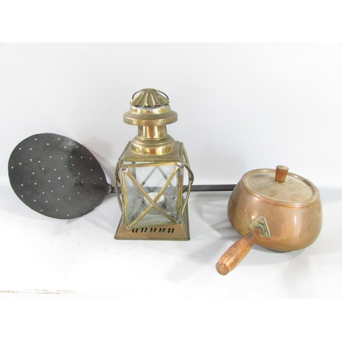 581 - A quantity of old copper and brass items, including a cauldron, weighing scale, kettles, a skimmer, ... 