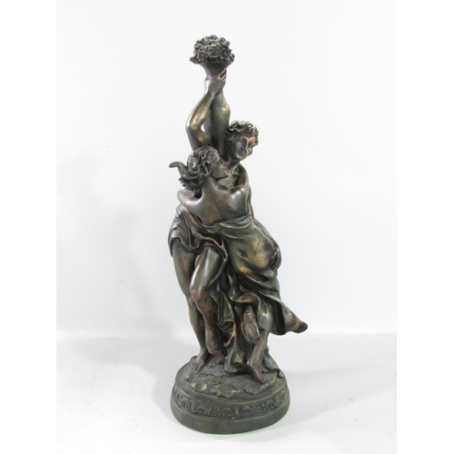 582 - A spelter figure of a victorious sailor, sword in hand, standing on elements of a ship raised on a s... 