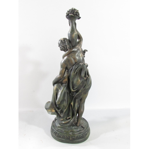 582 - A spelter figure of a victorious sailor, sword in hand, standing on elements of a ship raised on a s... 