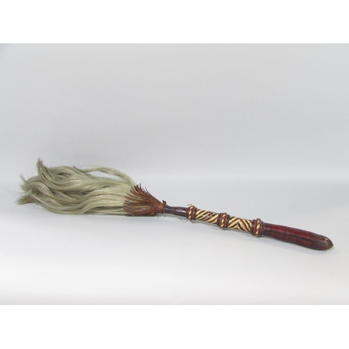 586 - A vintage African horse hair fly swot with a leather and cane bound handle.