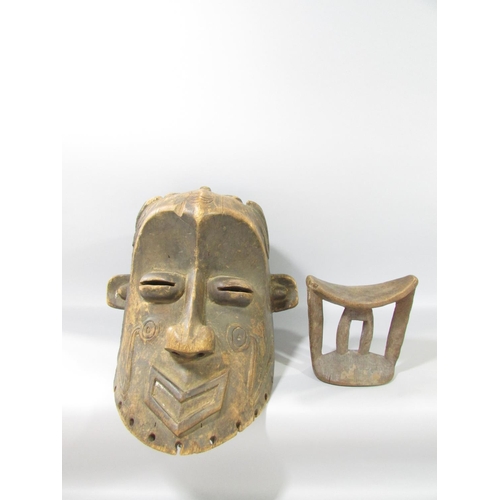 587 - A carved Congo River Head mask 33cm high, and an Ethiopian wooden headrest, 17cm high.