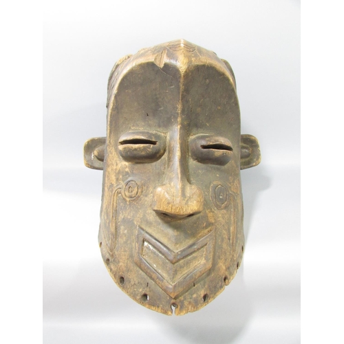 587 - A carved Congo River Head mask 33cm high, and an Ethiopian wooden headrest, 17cm high.