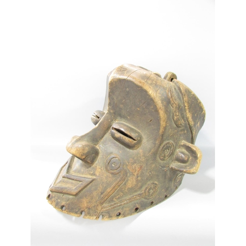 587 - A carved Congo River Head mask 33cm high, and an Ethiopian wooden headrest, 17cm high.