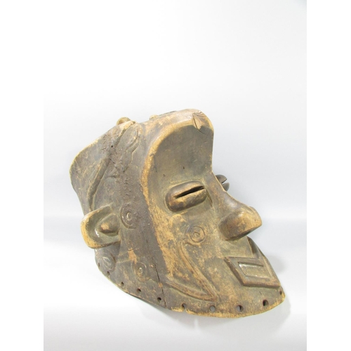 587 - A carved Congo River Head mask 33cm high, and an Ethiopian wooden headrest, 17cm high.