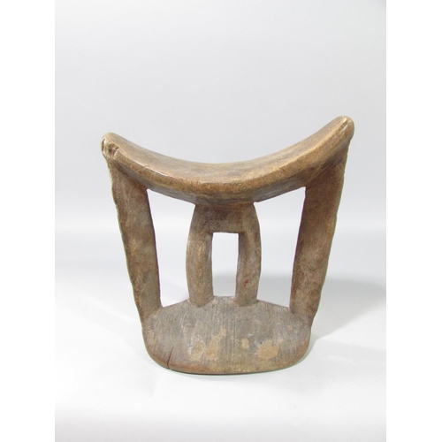 587 - A carved Congo River Head mask 33cm high, and an Ethiopian wooden headrest, 17cm high.