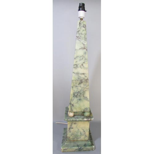 590 - A blue and green veined marble obelisk table lamp raised on spheres and a plinth. (Cracked and glued... 