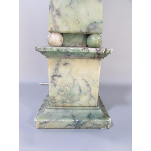 590 - A blue and green veined marble obelisk table lamp raised on spheres and a plinth. (Cracked and glued... 