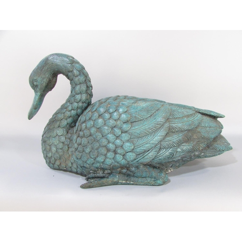 591 - A bronze study of a goose, life size, with verdigris finish, 50cm wide.